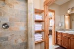 Walk-through vanity area to shower and toilet. All doors can be closed off for privacy. 